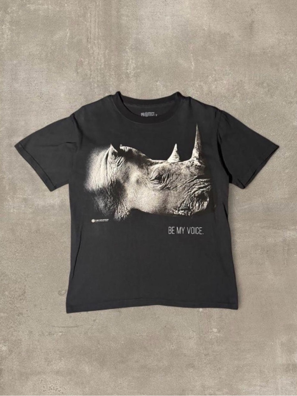 Black cotton rhino graphic tee with white rhino graphic and 'BE MY VOICE'